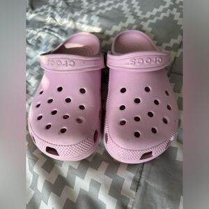 Pink Crocs.